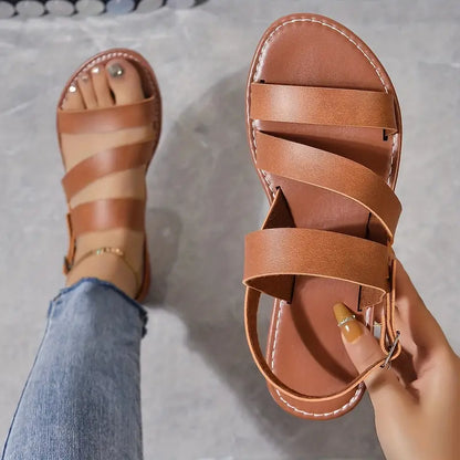 TS | Flat sandals with open back and buckle decoration